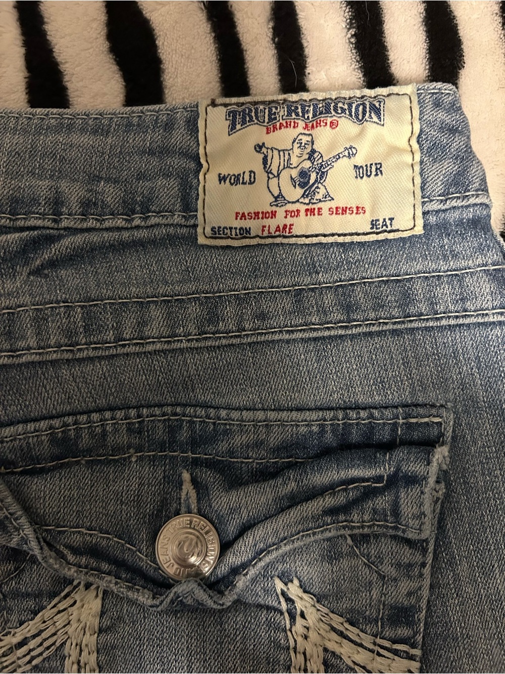 True Religion Light Blue Denim Flare Jeans with Signature Stitching